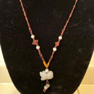 Necklace with jade dog pendant